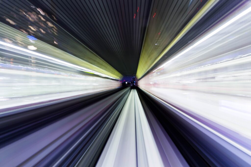 purple, white, and yellow streaks of light indicate speed and movement