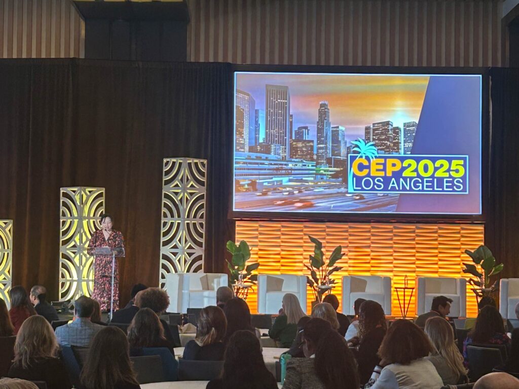 photo of the stage at CEP's 2025 conference with audience members in the foreground